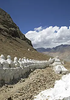 Small white stupa on the mountainside