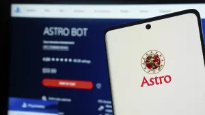 Smartphone with Astro logo on screen next to a digital app interface