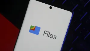 Smartphone displaying Files by Google logo on screen over dark background