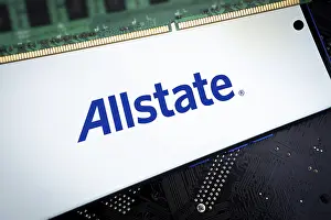 Smartphone with logo allstate insurance company on paper policy and money currency