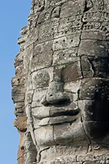 The smile of Angkor, huge face carved in stone on a tower