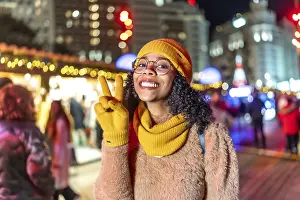 Smiling young woman wearing yellow gloves