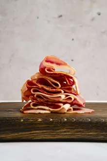 Smoked bacon pieces stacked in a stack