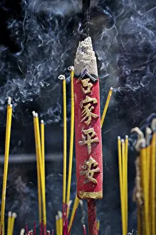 Smoking incense in the temple Chua Thien Hau Pagoda