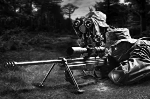 Sniper together with the gunner took the position and expect the target