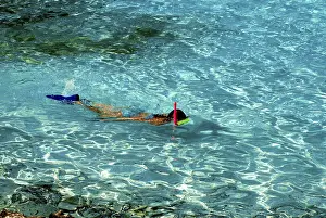 Snorkelling in the crystal clear waters of Half Moon Kay
