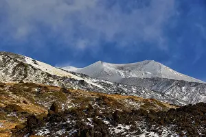Snow-capped Etna peaks, barren