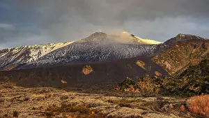 Snow-capped Etna peaks, volcano at dusk