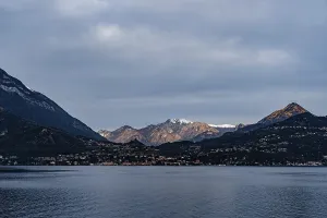 Snow-capped peaks of a mountain range in sunbeams