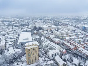 Snow-covered district with striking high-rise and industrial architecture