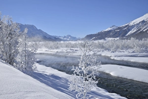 Snow-covered landscape and the Inn River