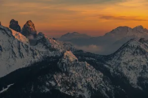 Snow-covered mountain peaks of the Bosconero group at sunset