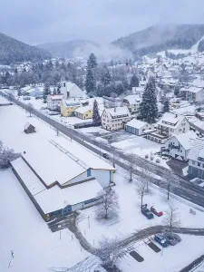 Snow-covered streets and houses of a village in wintry mountains