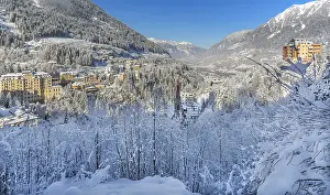 Snow-covered winter panorama of the village and valley