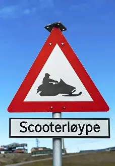Snow mobile warning road signpost