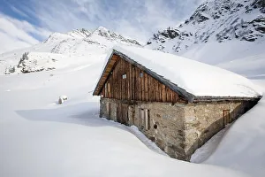 Snowcovered mountain hut, Malfontal