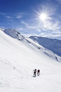 Snowshoers climbing Mt. Hoertlahner above Durnholz