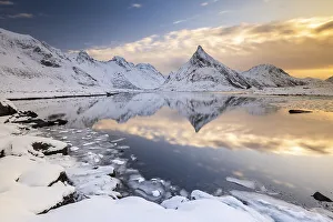 Snowy landscape with mountains and fjord