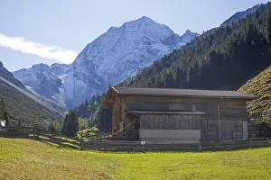 Framed Print : Snowy mountain hawk with cattle shed on the Pinnisalm in autumn