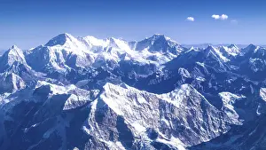 Snowy mountain landscape under bright blue sky