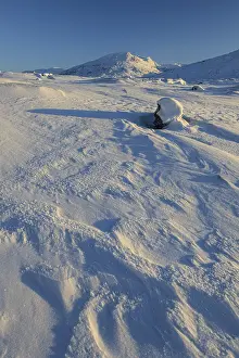 Snowy mountain landscape, evening light
