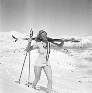 In the snowy mountains 1940s. Olga Sjoegren from Stockholm is dressed in the typical 1940s swim suit fashion when climbing the snowy mountain Kuoblatjakko in Norrbotten Sweden