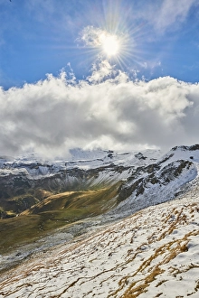 Snowy Mountains with clouds at Hochalpenstrasse