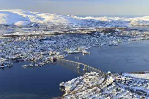 Snowy town with bridge, islands in the North Sea