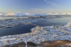 Snowy town with bridge, islands in the North Sea