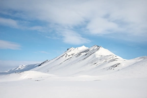 Snowy volcanic landscape with mountains
