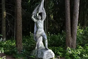 Framed Print : Socialist sculpture in the green forest of Grutas Park in Druskininkai