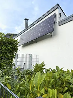 Solar panels on a house wall in Hilden, Germany