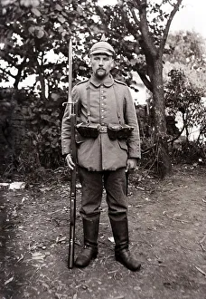 Soldier with spiked helmet and fixed bayonet