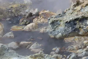 Solfatara field with hot pools and boiling mud at Seltun