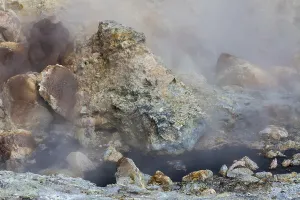 Solfatara field with hot pools and boiling mud at Seltun