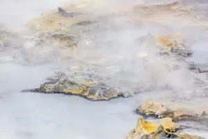 Solfatara field with hot pools and boiling mud at Seltun