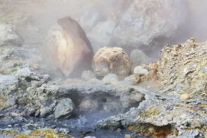 Solfatara field with hot pools and boiling mud at Seltun