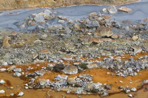 Solfatara field with hot pools and boiling mud at Seltun