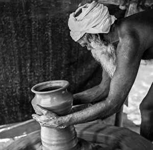 South Asian Indian old man making a pot by hand