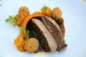 South German cuisine, pink roasted duck breast in spiced honey