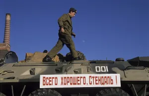 Soviet soldier on tank and a banner reading All the best