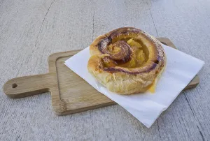 Spanish puff pastry bun filled with orange marmalade