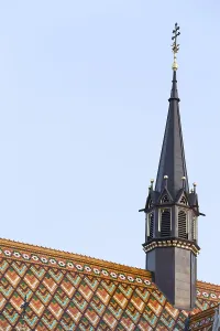 Spire and diamond shape roof tiles of the Matthias Church in Budapest