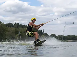 Sporty man with wakeboard, water sports