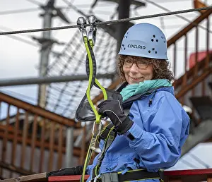 Sporty woman climbing in an outdoor park