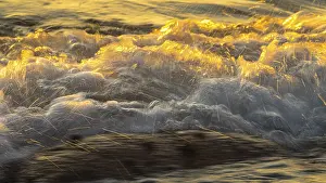 Framed Print : Spray, waves on the beach, sunset