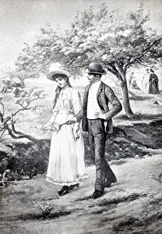 Spring awakening, young couple walking under blooming trees
