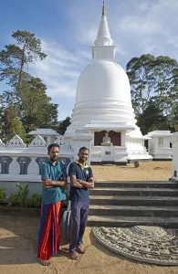 Sri Lankan men at the Chayathi Stupa in the International Buddhist Centre Temple