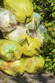 Stacked yellow bags for plastic waste, Germany