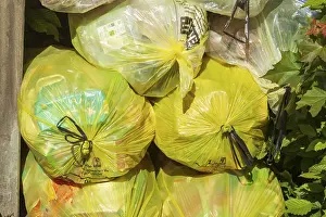 Stacked yellow bags for plastic waste, Germany